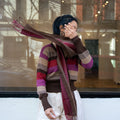 Atardecer Alpaca Scarf — striped alpaca knit in sunset hues, designed to match the Atardecer Cardigan, handmade in Bolivia.