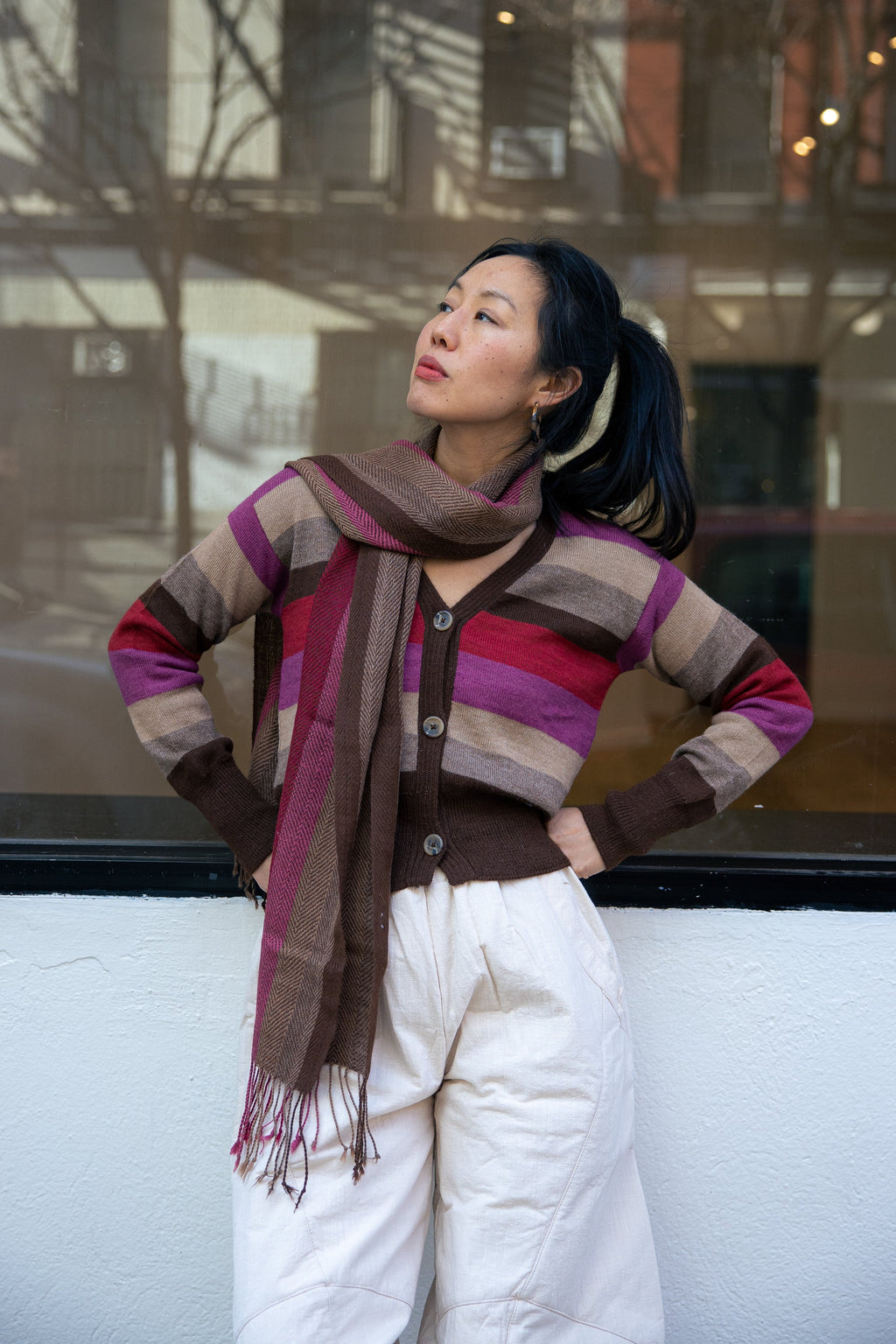 Atardecer Alpaca Scarf — striped alpaca knit in sunset hues, designed to match the Atardecer Cardigan, handmade in Bolivia.