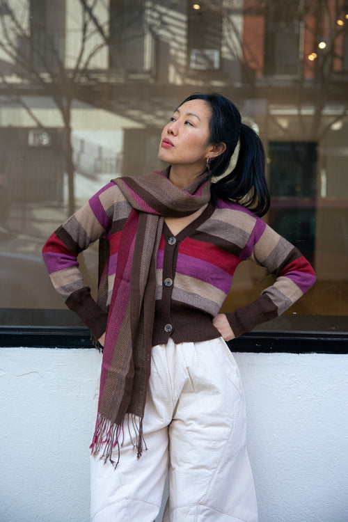 Atardecer Alpaca Scarf — striped alpaca knit in sunset hues, designed to match the Atardecer Cardigan, handmade in Bolivia.