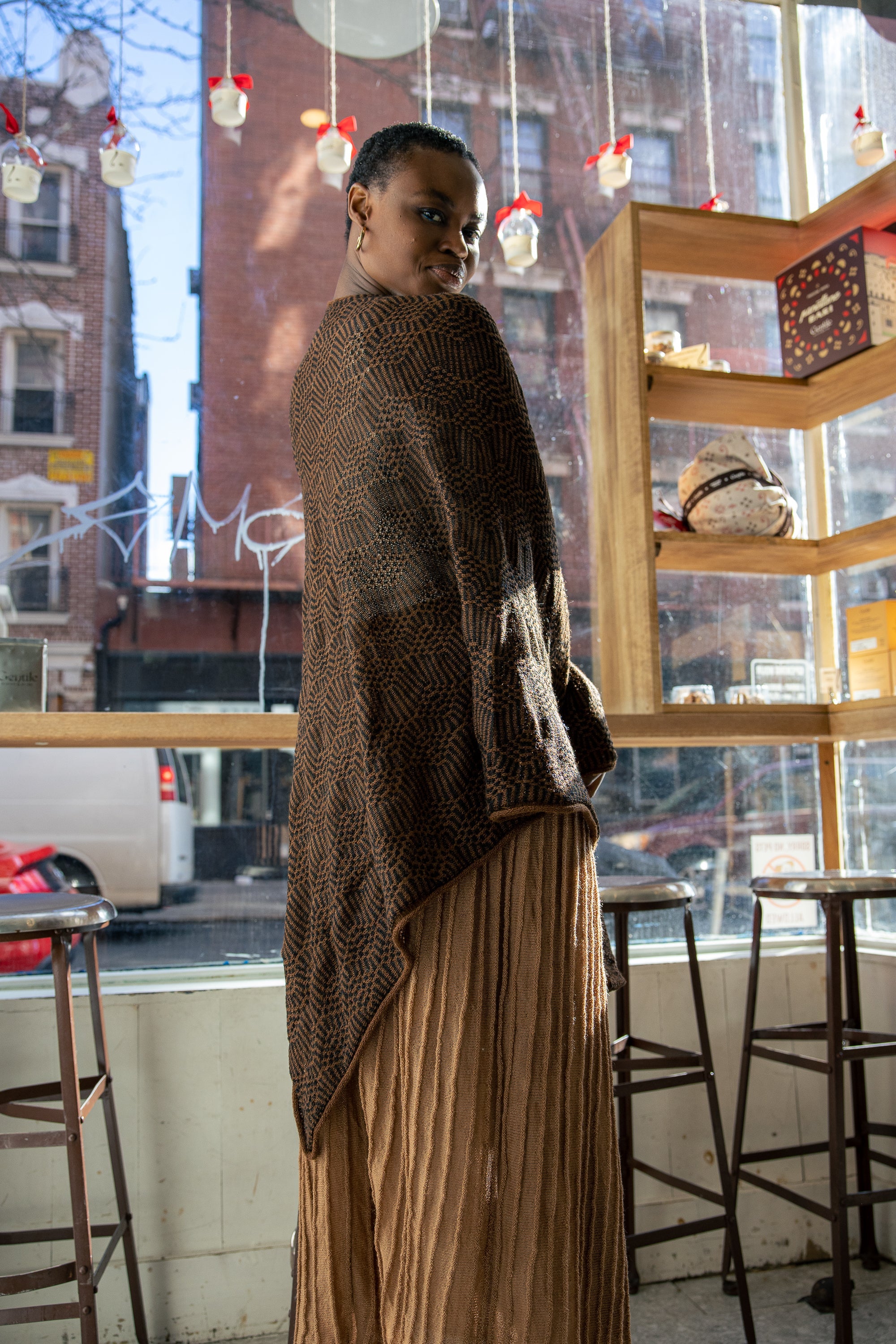 Chama Alpaca Poncho — alpaca poncho with relaxed silhouette, handmade in Bolivia, inspired by Aymara word for “strong and positive energy.”