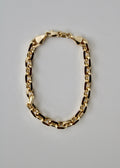 Gold knife-edge chain bracelet on a white background