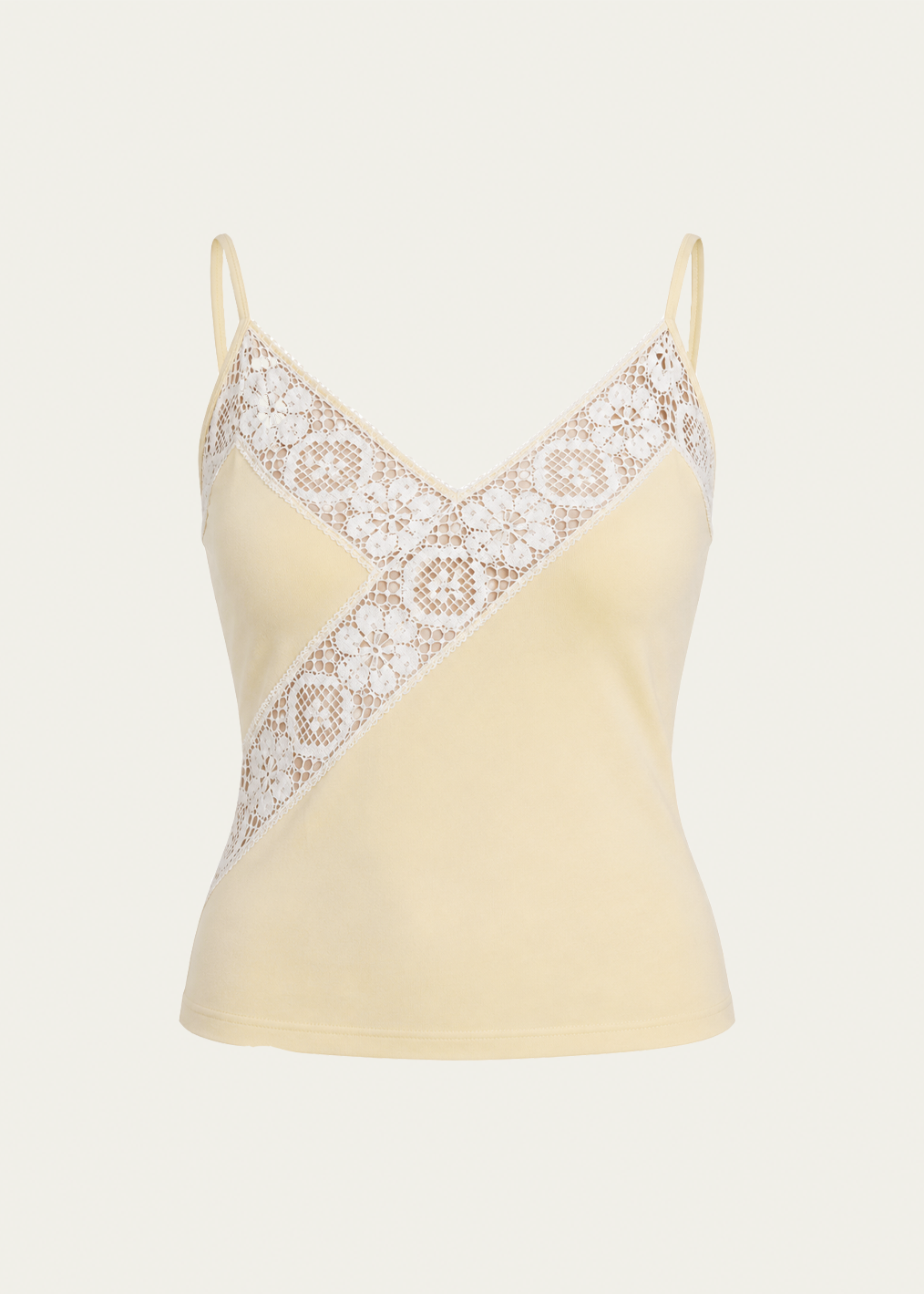 A pale yellow camisole top with thin straps and a diagonal white lace panel across the chest, shown on a light gray background.