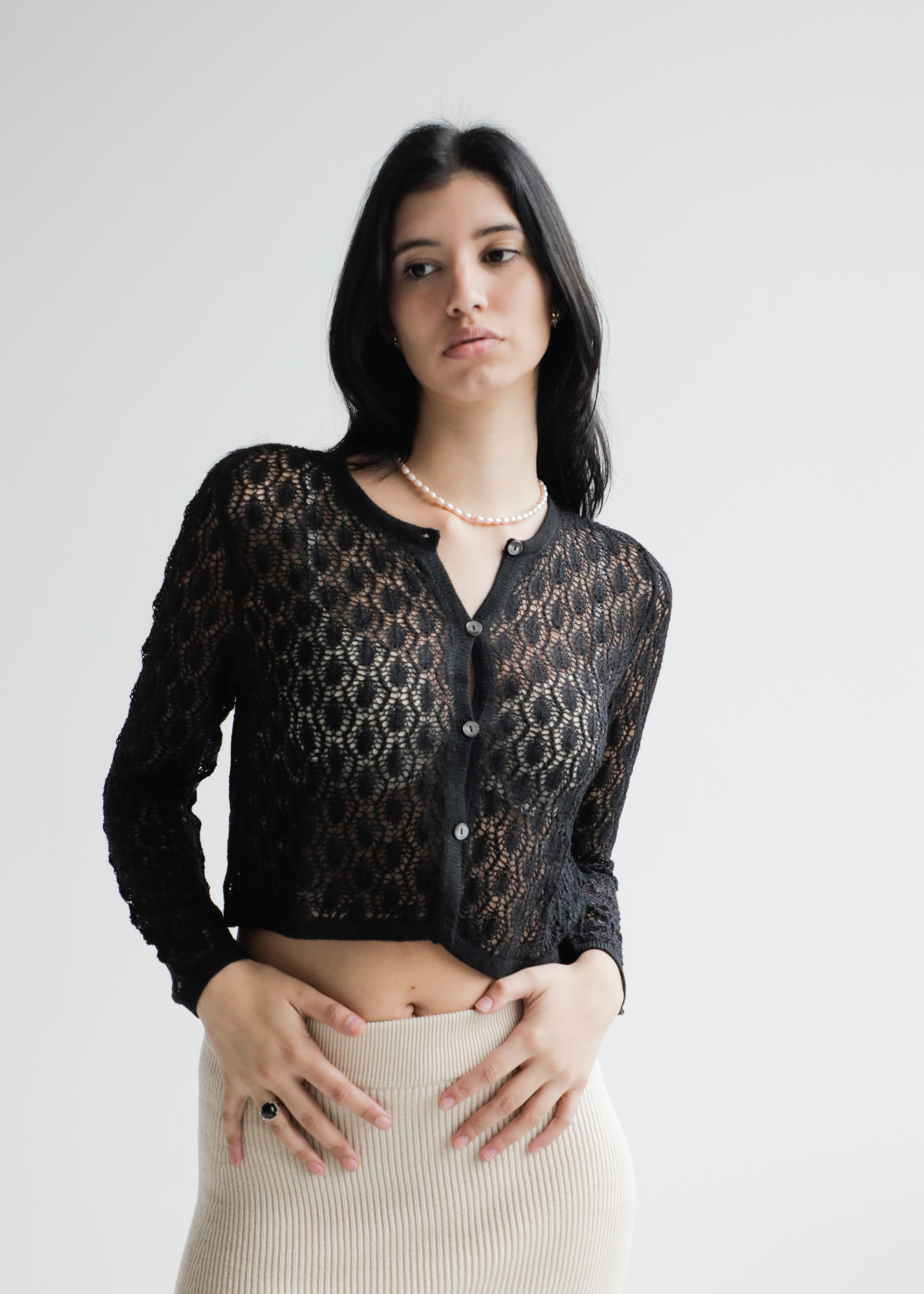 Wara Crop Alpaca Cardigan — cropped alpaca cardigan with artisanal finish, handmade in Bolivia, inspired by the Aymara word for “star.”