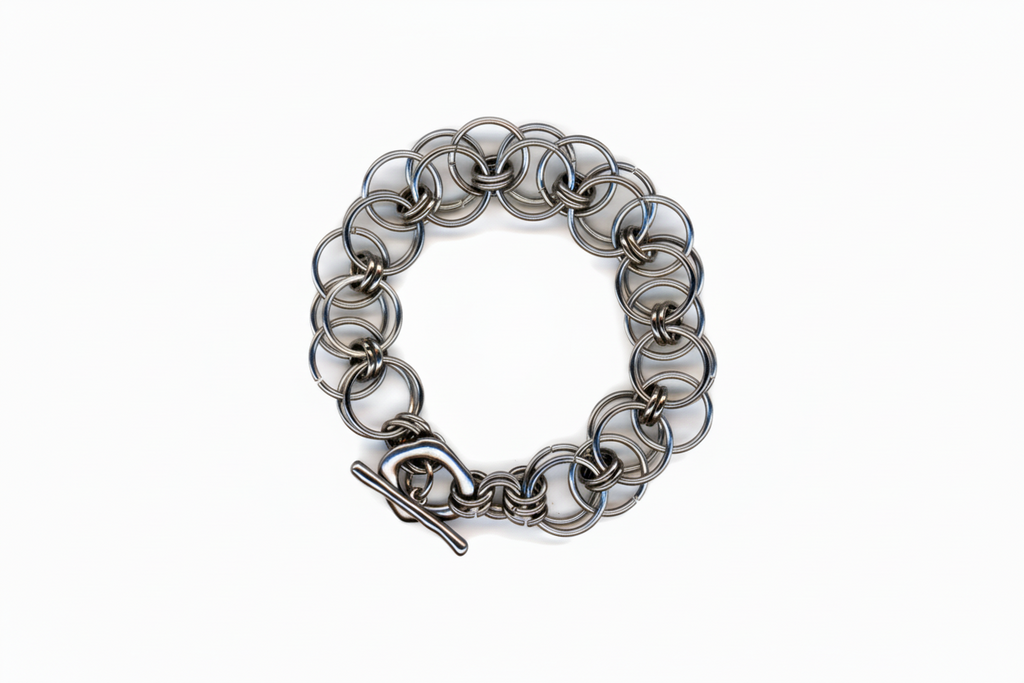 Silver chainmail bracelet on a white background