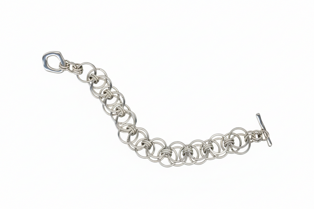 Silver chain bracelet on a black background