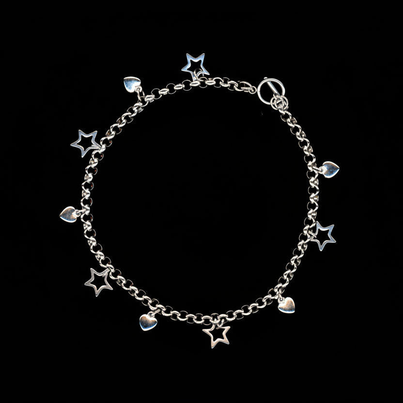 A silver stainless steel charm necklace with heart and star charms, presented against a black background.