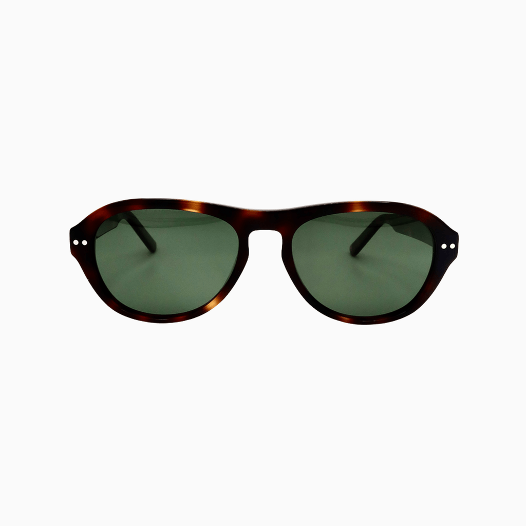 Close-up of Ciren glossy tortoiseshell acetate frame and green lenses