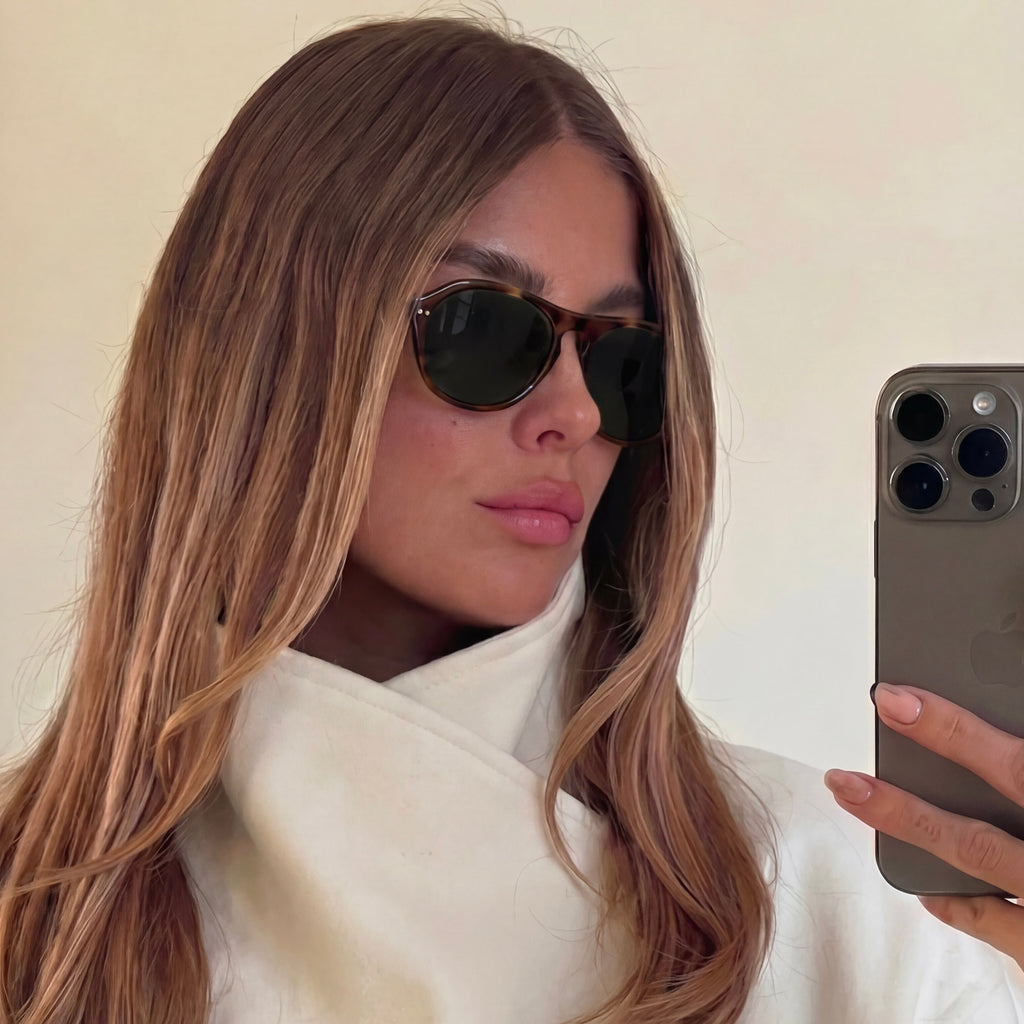 Model wearing Ciren oval tortoiseshell sunglasses, selfie