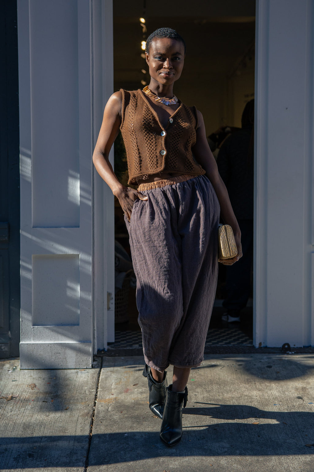 Panti Alpaca Vest — hand-crocheted alpaca vest with openwork stitch, crystal or mother-of-pearl buttons, artisan-made in Bolivia.