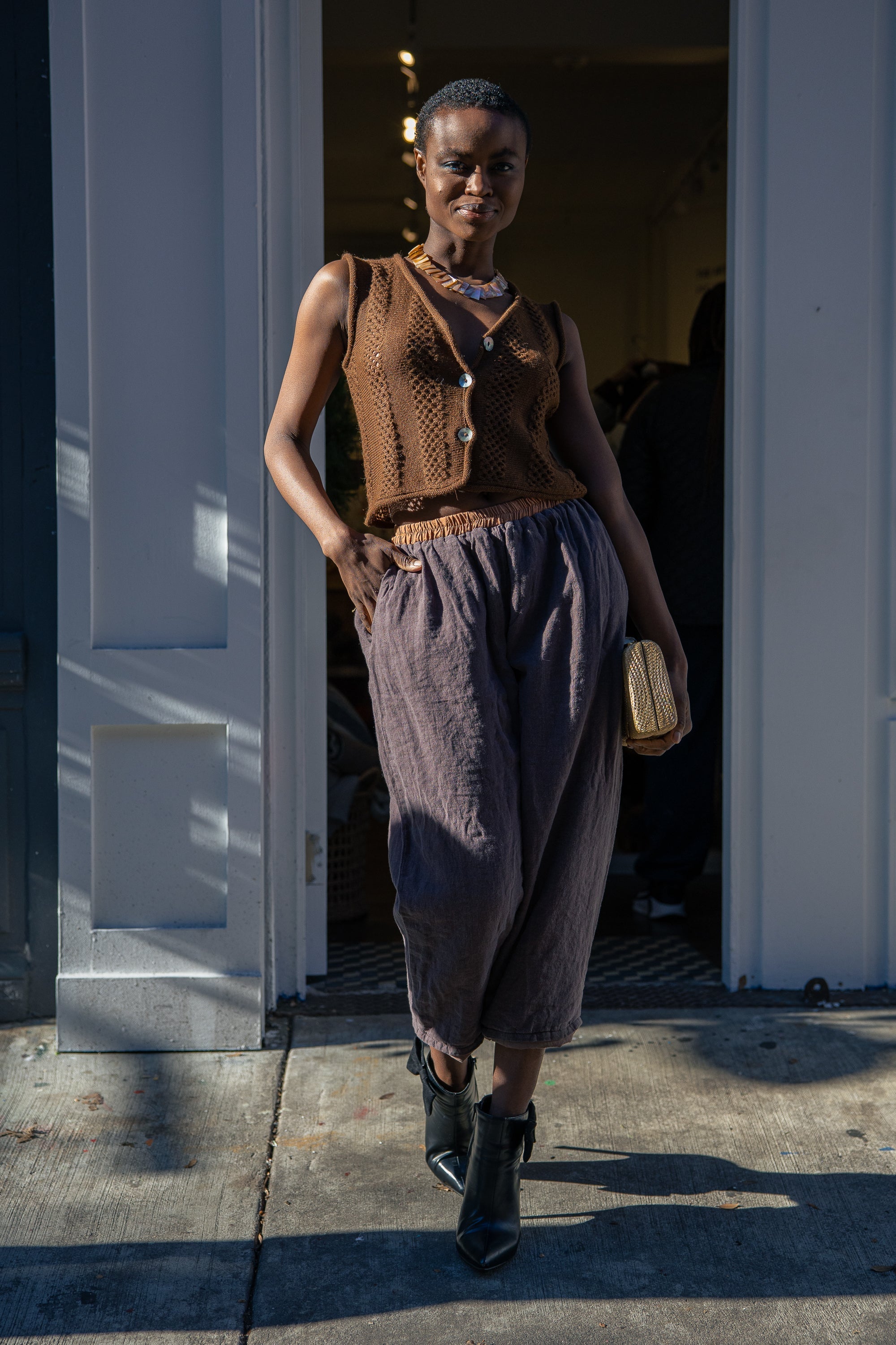 Panti Alpaca Vest — hand-crocheted alpaca vest with openwork stitch, crystal or mother-of-pearl buttons, artisan-made in Bolivia.