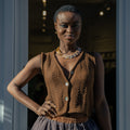 Panti Alpaca Vest — hand-crocheted alpaca vest with openwork stitch, crystal or mother-of-pearl buttons, artisan-made in Bolivia.