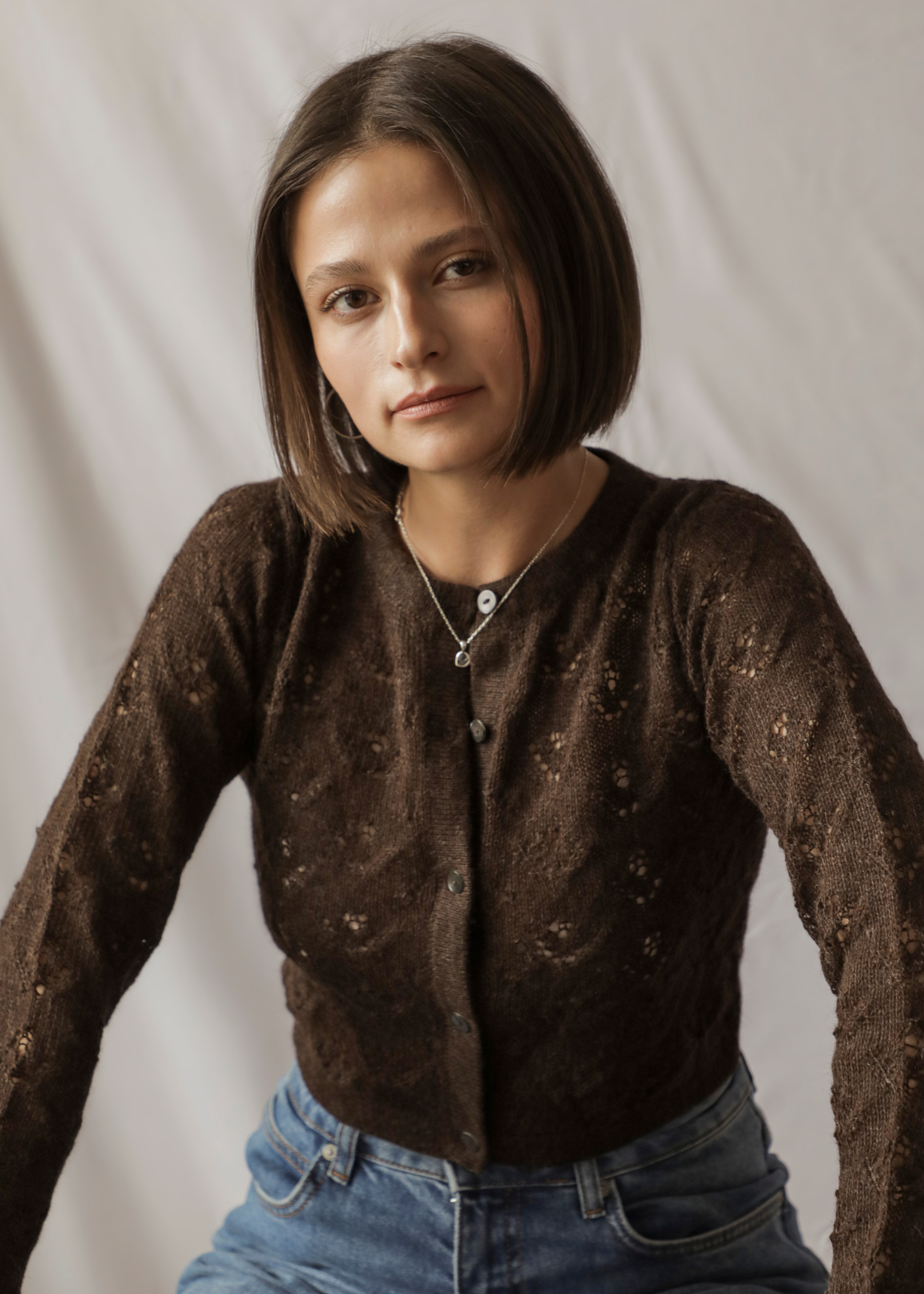 Qupana Alpaca Cardigan — cropped baby alpaca cardigan with delicate lace stitch, lightweight and handmade in Bolivia.