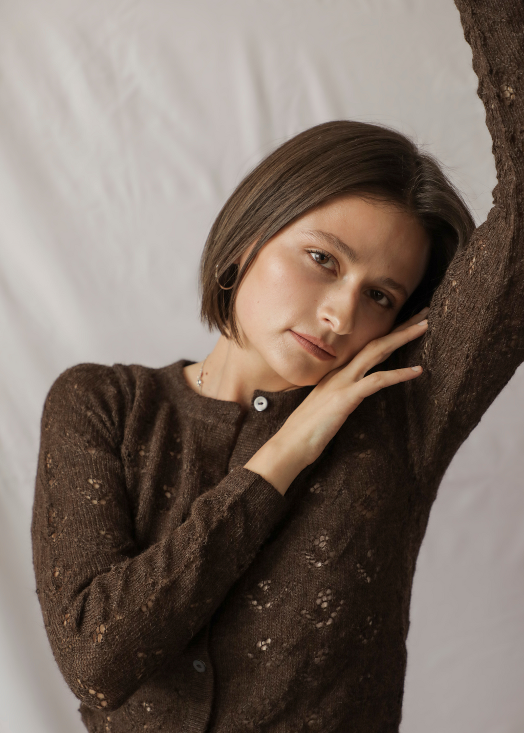 Qupana Alpaca Cardigan — cropped baby alpaca cardigan with delicate lace stitch, lightweight and handmade in Bolivia.