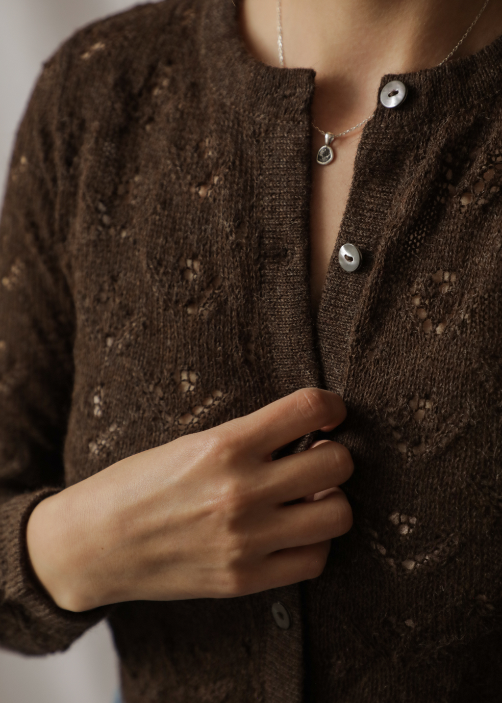 Qupana Alpaca Cardigan — cropped baby alpaca cardigan with delicate lace stitch, lightweight and handmade in Bolivia.