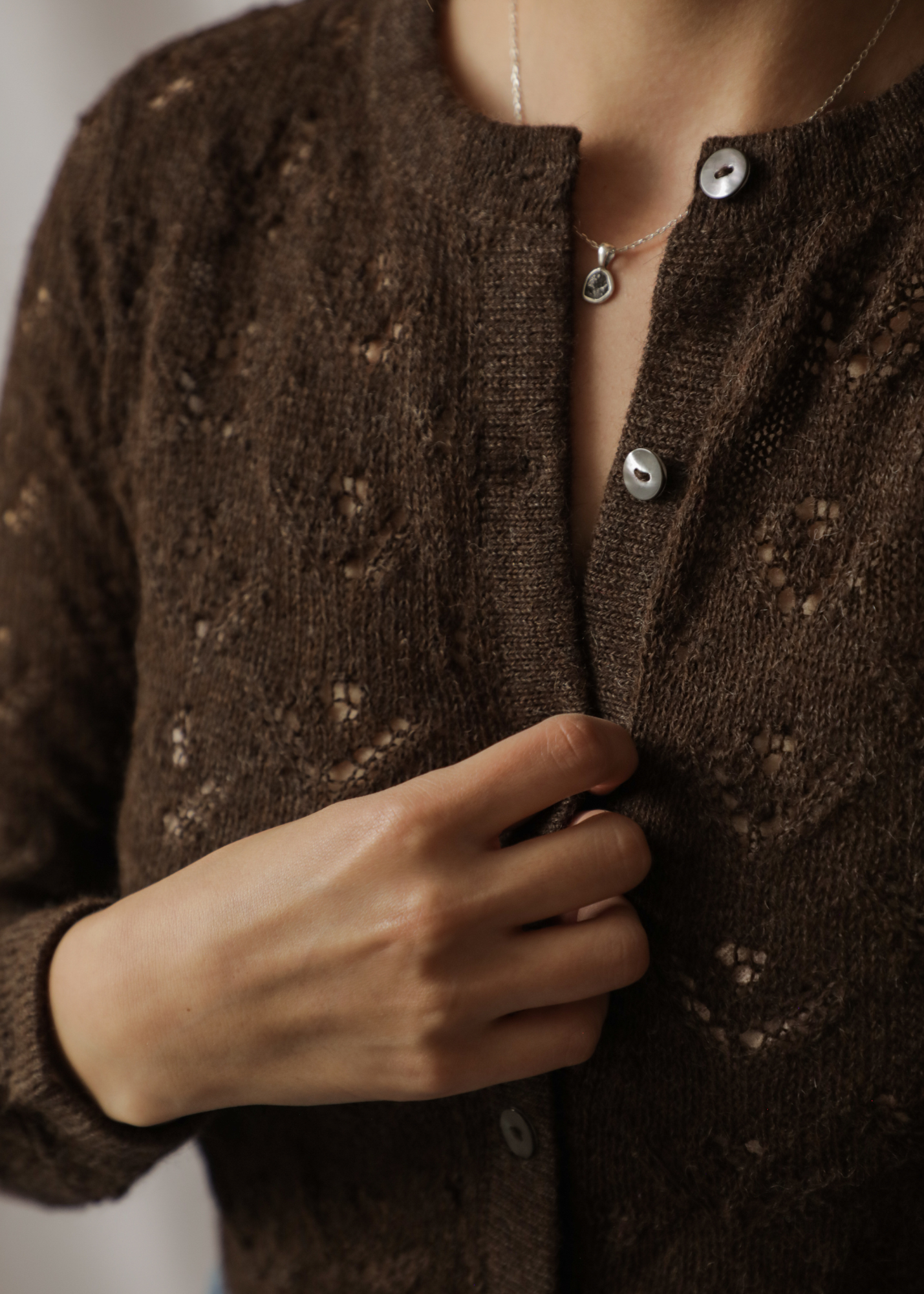 Qupana Alpaca Cardigan — cropped baby alpaca cardigan with delicate lace stitch, lightweight and handmade in Bolivia.